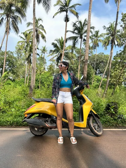 Standing by my yellow scooter on Parra Road in Goa. This picture is a manifestation of a long-held dream.