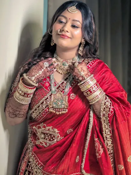 Adjusting her gorgeous jewelry, Nehal's soft brown smokey eyes and dewy skin are on full display. This is my signature minimal wedding makeup.
