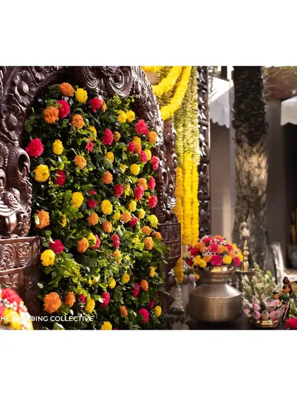 A close-up of the intricate floral work on the Prabhavali, where bursts of colourful flowers are set against a bed of lush greenery. This detail showcases our skill in creating beautiful, textured floral backdrops.