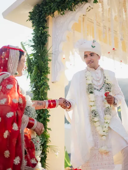 The moment the bride and groom see each other at the mandap. The exchange of looks and the holding of hands is a beautiful start to their life together.