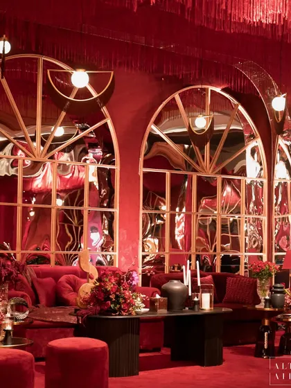 The play of reflections in the custom-made arched mirrors at 'Le Rouge'. This design element was key to creating the dramatic, sexy, and sophisticated vibe we aimed for.