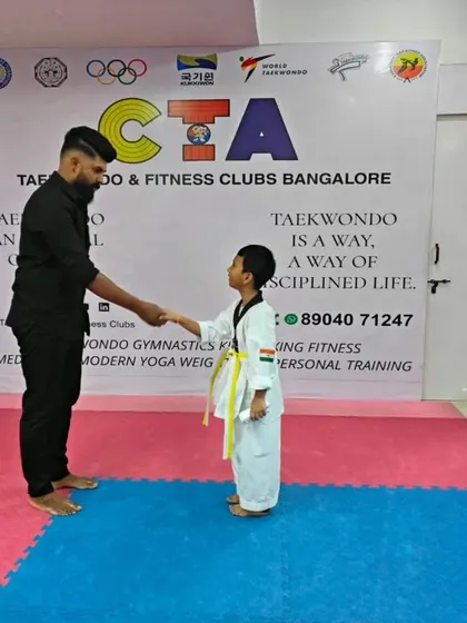 A handshake for a new yellow belt.