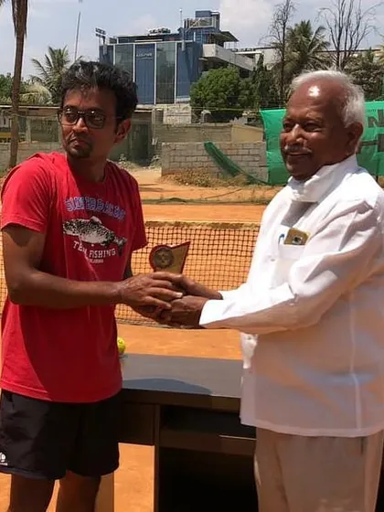 Here is another champion from our corporate tennis tournament. The sense of accomplishment is a great morale booster for any team member.