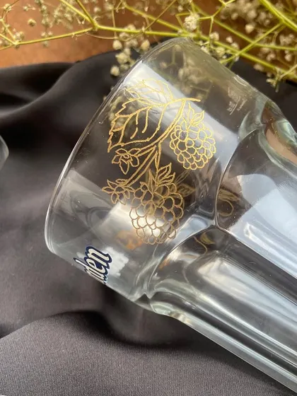 For this project with Hoegaarden India, I engraved their classic beer glasses with names and custom illustrations of oranges and raspberries, as a nod to the beer's flavors. It was so much fun to bring this idea to life.