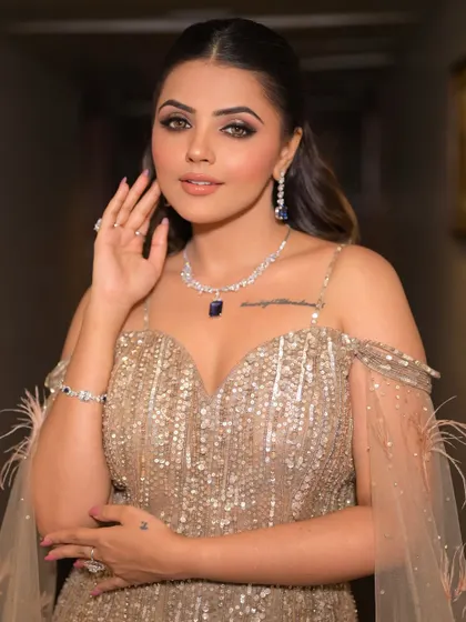Confidence is the best accessory. Her high-definition makeup highlights her features beautifully, ensuring she looks and feels her absolute best for her special evening.