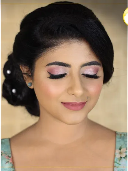 A soft and romantic makeup look, paired with an elegant low bun. This is a perfect style for a pre-wedding photoshoot or a daytime event.