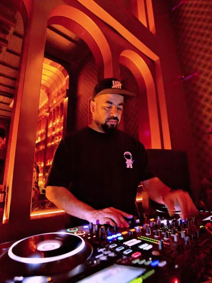 On the decks at 10SpeakEasy, surrounded by the warm, intricate decor.