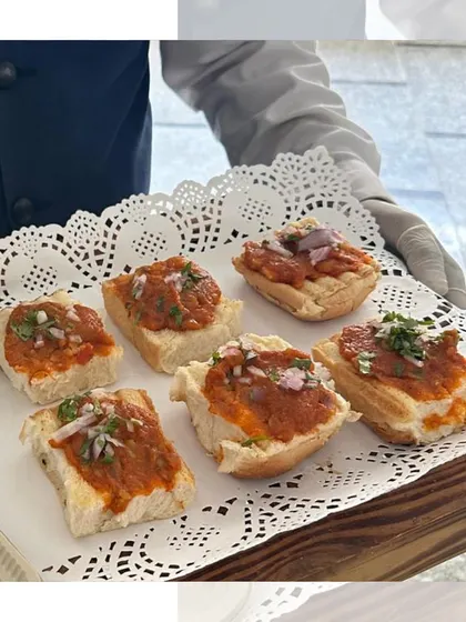 Another take on our bite sized Pav Bhaji. Here, the savory vegetable mash is served on top of small bread pieces, offering all the flavor of the classic dish in one perfect mouthful.