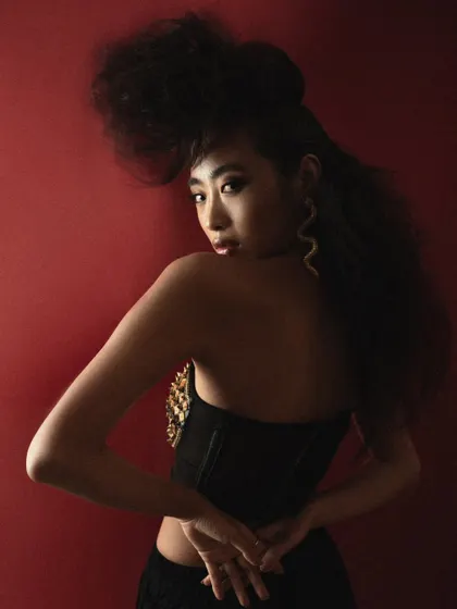 A powerful three-quarter pose where the model's gaze and posture command attention. This is a strong addition to a high-fashion model book.