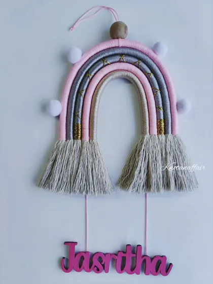 Looking for unique nursery decor? This pretty macrame rainbow with the name 'Jasritha' is a great option. It's customizable in any size and color.