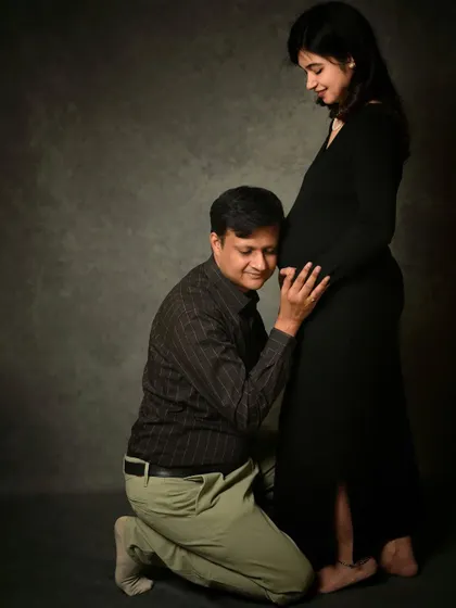 The dad-to-be listening in, full of anticipation. It's a beautiful way to include the partner in the maternity session.