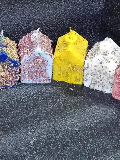 Nine days, nine colors, nine vibes. I've got a candle for each day of Navratri. These herb-dressed house-shaped candles match the color of the day.