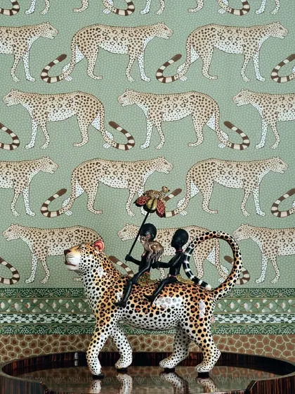 A whimsical scene from the Cole & Son Ardmore collection, where leopards are rendered with artistic charm. This wallpaper is a celebration of African wildlife and artistry, perfect for creating a space that is both playful and deeply sophisticated.