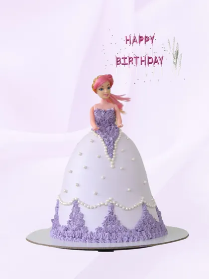 A beautiful doll cake that looks like it's straight out of a fairy tale. The cake forms the doll's voluminous gown, decorated with lovely lavender and white buttercream piping and pearl details.