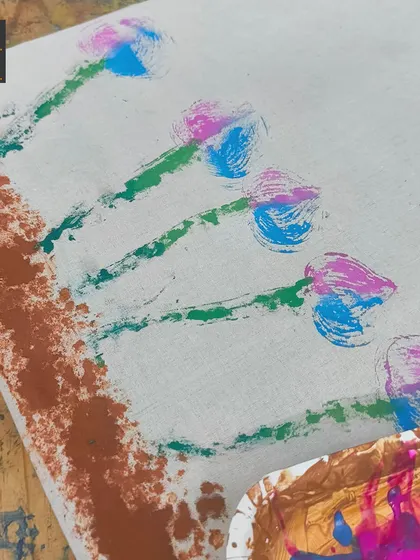 A close-up of the beautiful tulip design created with vegetable printing. You can see the distinct textures made by the cut vegetables, turning a simple potato into an effective stamp.