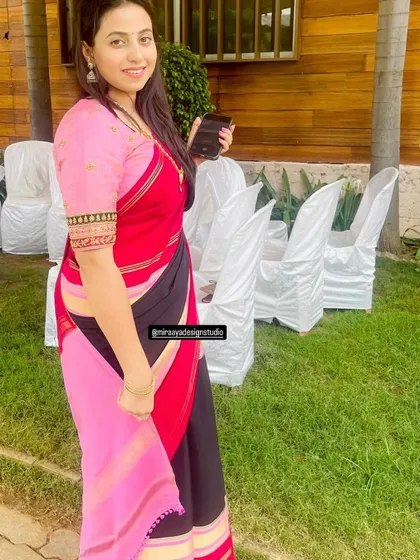 Soundarya in a multi-colored saree. I designed a simple pink blouse with an embroidered sleeve border to tie the whole look together.