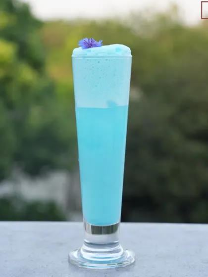 We cannot tell you what color happiness is, but it might just be blue. Our Blue Velvet cocktail is a visual delight, with its striking color and frothy top.
