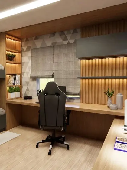 The study area in the bunk bed room, with a long desk and overhead storage.