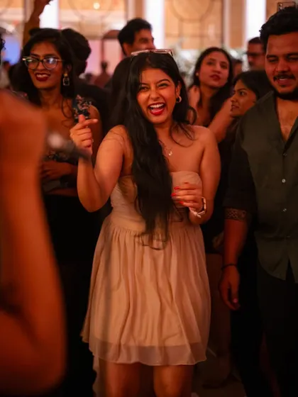The pure energy of a New Year's celebration. A guest dances with joy, surrounded by friends, as we ring in the new year together.