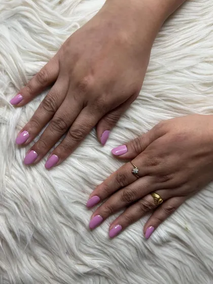 A different angle of the lavender gel polish nails, highlighting the clean application and elegant shape.