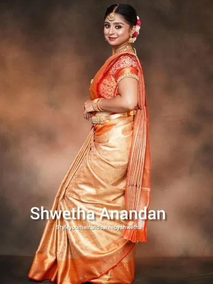The side profile of a bridal drape is just as important as the front. I ensure the pleats are neatly tucked and the saree flows beautifully from every angle.