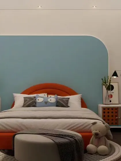 A bright and cheerful kid's bedroom with a playful mix of orange and blue. The design includes a rounded accent wall and a dedicated vanity area with a circular mirror, creating a fun and stylish personal space.