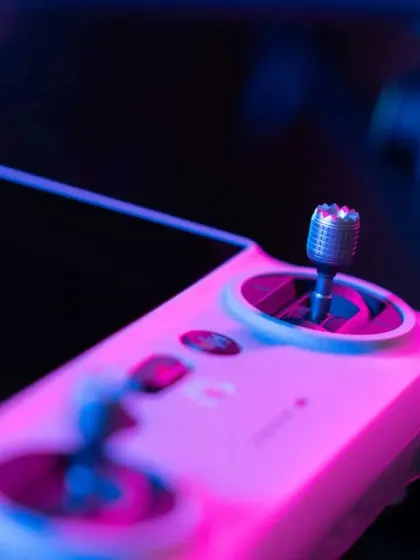 A detailed shot of the DJI smart controller used to pilot the drone. The precise control sticks and integrated high-brightness screen are essential for executing complex, cinematic flight paths safely during an event.