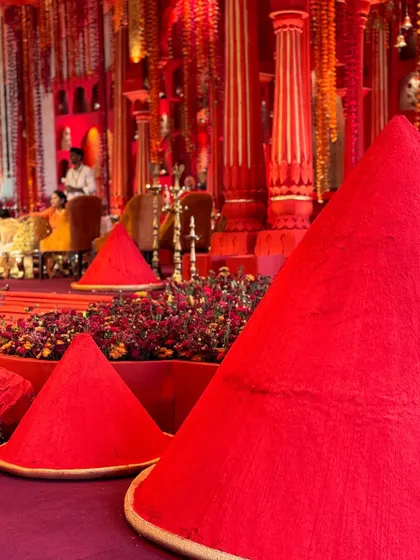Mounds of sindoor, a key element of our 'Lal Bagh' design concept. This use of bold, traditional color creates a powerful visual canvas and adds a striking, innovative touch to the decor.