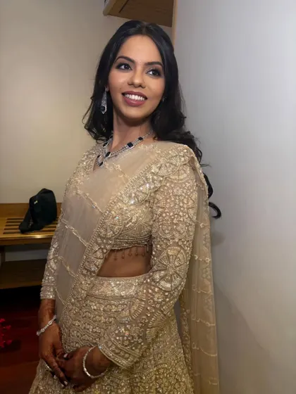 Another beautiful portrait of the bride, looking confident and glamorous. The soft curls and defined eyes complete her perfect engagement look.