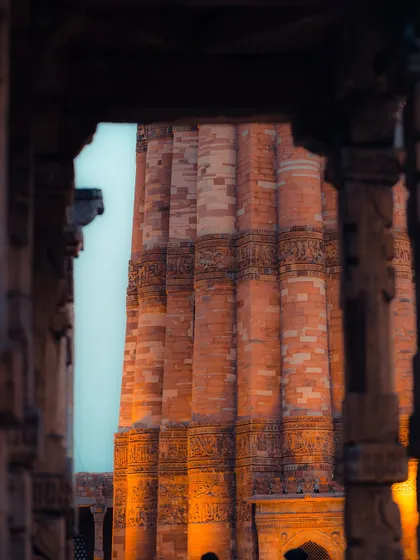 Qutub Minar framed by the pillars of a nearby colonnade. Using architectural elements for framing is a technique I frequently use to add depth and perspective.