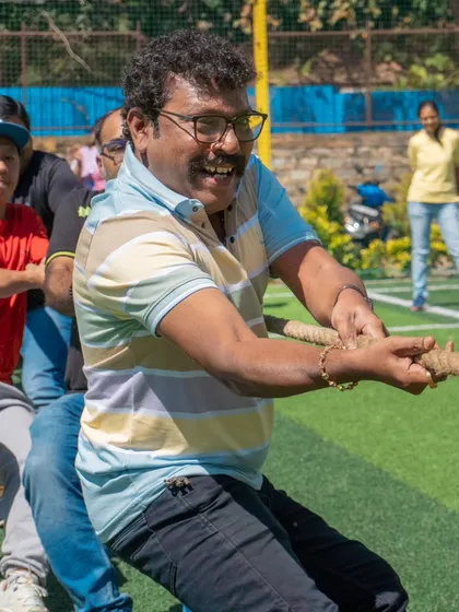 The dads give it their all in a game of tug-of-war. The competitive spirit is alive and well in our parent community too.