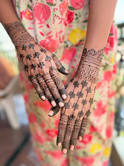 A simple yet stunning design featuring trails of lotus flowers. This minimalist approach is perfect for someone who wants an elegant and uncluttered look.