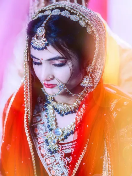 A candid bridal portrait capturing the bride's intricate jewelry and traditional attire. Even in more classic shots, I look for the natural expression to keep the photo feeling authentic.