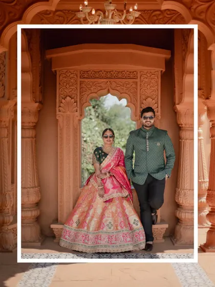 A cool and composed pre-wedding portrait of the couple posing in a beautifully carved archway, both wearing sunglasses.