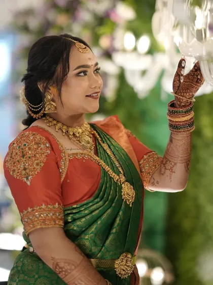 Tejaswini looking radiant, her personalized blouse adding a unique touch to her traditional look.