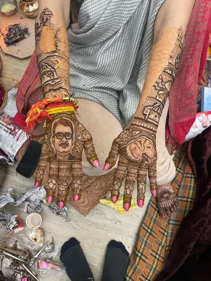 Another example of a custom pet portrait mehndi. This client wanted her dog included alongside a portrait of her partner, making for a truly unique and modern design.