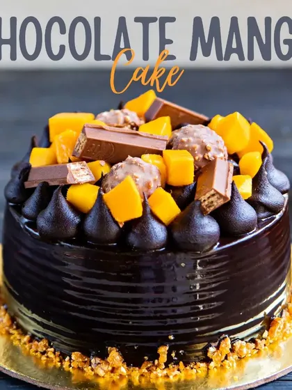 For those who can't decide between chocolate and mango, we created this masterpiece. A rich chocolate cake topped with fresh mango chunks, KitKat pieces, and Ferrero Rocher.