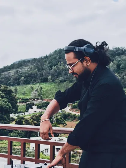 Finding my focus and rhythm while DJing outdoors. The natural backdrop adds a different kind of inspiration to the music.