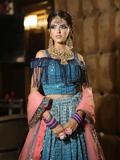 A full-length view of the stylish blue lehenga, showing the beautiful color combination and modern design.