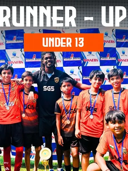 The Under 13 runner-up team with their medals and coach. We celebrate the journey and the lessons learned, knowing we will come back stronger.