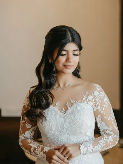 A modern bride ready for her white wedding. I created a soft, romantic look with sparkling eyes, a natural lip, and effortless waves to complement her lace gown.