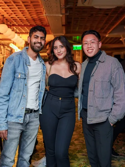 A group of friends looking cool and casual, ready for a night of old school hip hop and classic anthems.