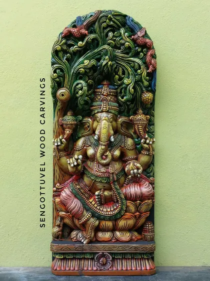 Our 36-inch multicolored Ganesha panel with Jali (latticework) is a vibrant masterpiece. Lord Ganesha is depicted under the Bodhi tree, and the hand-painted colors make every detail stand out.