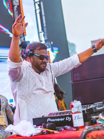 Hands in the air, feeling the energy of the massive crowd. Holi vibes are the best vibes.