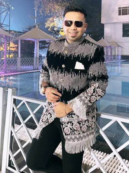This black and silver embroidered jacket is a real showstopper. It's perfect for a grand Sangeet night at a destination wedding.
