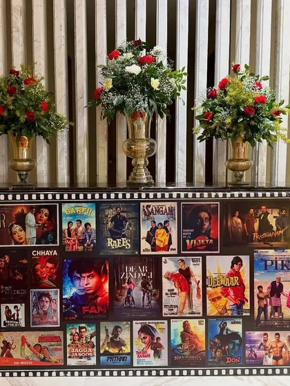 A custom-made console table decorated with a collage of classic Bollywood movie posters. This piece served as both a functional surface and a major decorative element, sparking nostalgia and conversation.