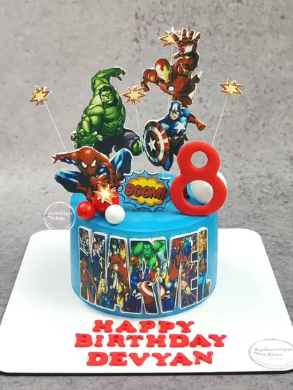 An action-packed, non-fondant Avengers cake for a young superhero. This cake brings together Hulk, Iron Man, Captain America, and Spiderman in a dynamic scene, ready to save the day.