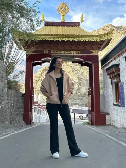 Finding a reason to pose at a monastery gate in Ladakh. The architecture and artistry of these sacred places are a constant source of inspiration.