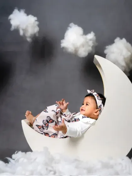 Basking in moonlight magic with our little star. This dreamy setup is one of our most requested for baby girls.