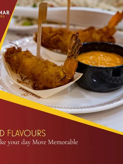 We use bold flavors to make your day more memorable. These crispy fried prawns are served with a tangy dipping sauce, offering a delightful crunch and taste.